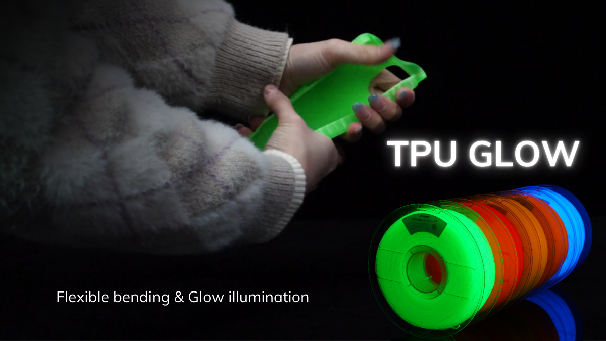 Person holding a flexible green 3D printed object made with TPU glow filament. Below shows multiple spools of glowing TPU filament in different colors including green, red, orange, and blue