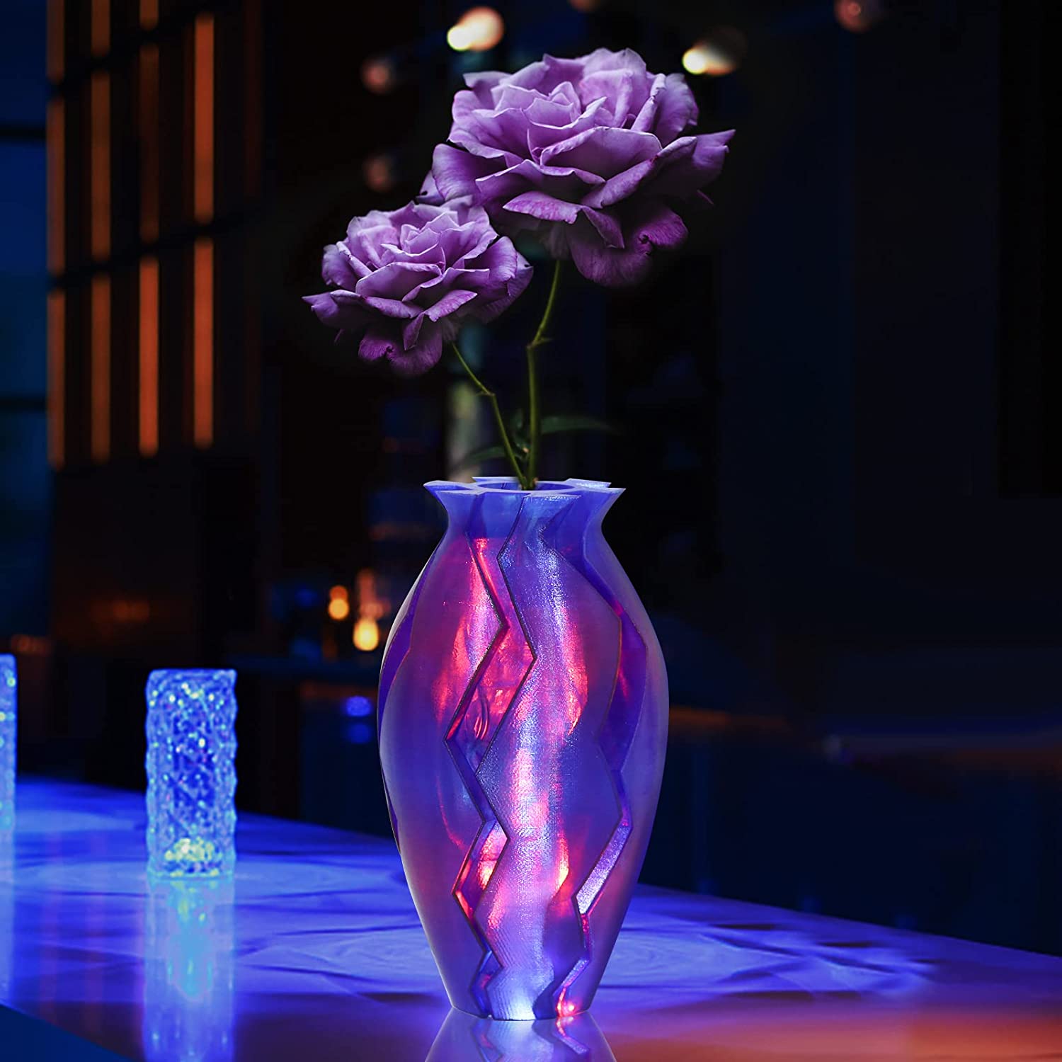 3D-printed vase showcasing Amolen PLA gradient filament with purple roses and light effects.