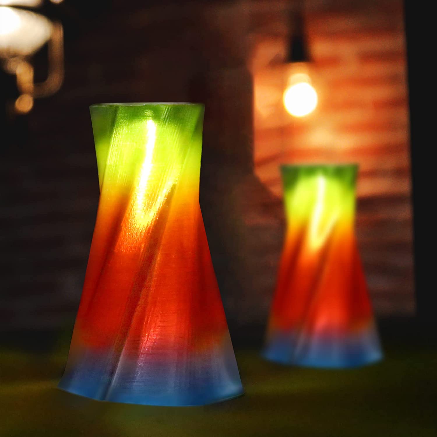 Amolen PETG Rainbow filament 3D printed vases with gradient colors, showcasing transparent effects and unique design.