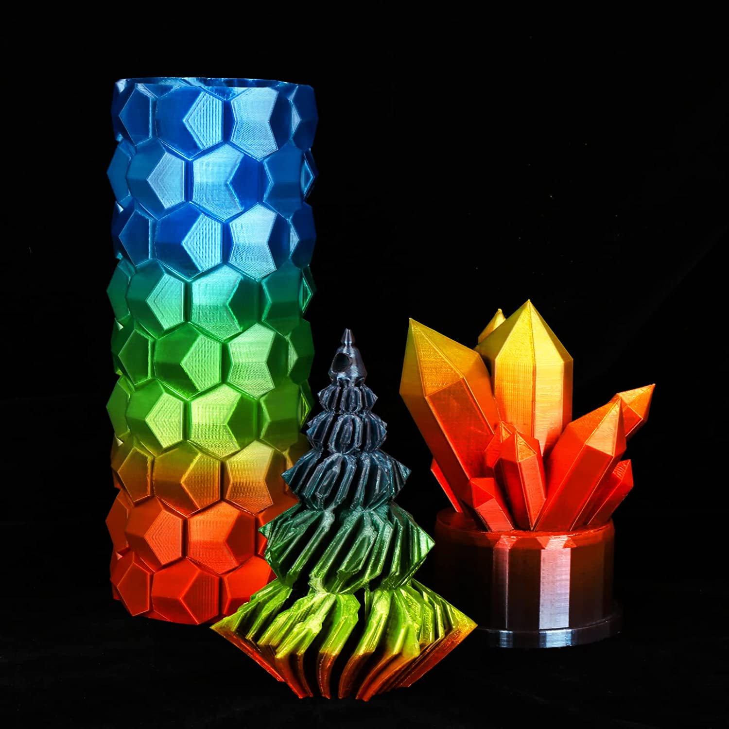 3D-printed models using Amolen PETG Rainbow filament, demonstrating gradient color and transparent effects